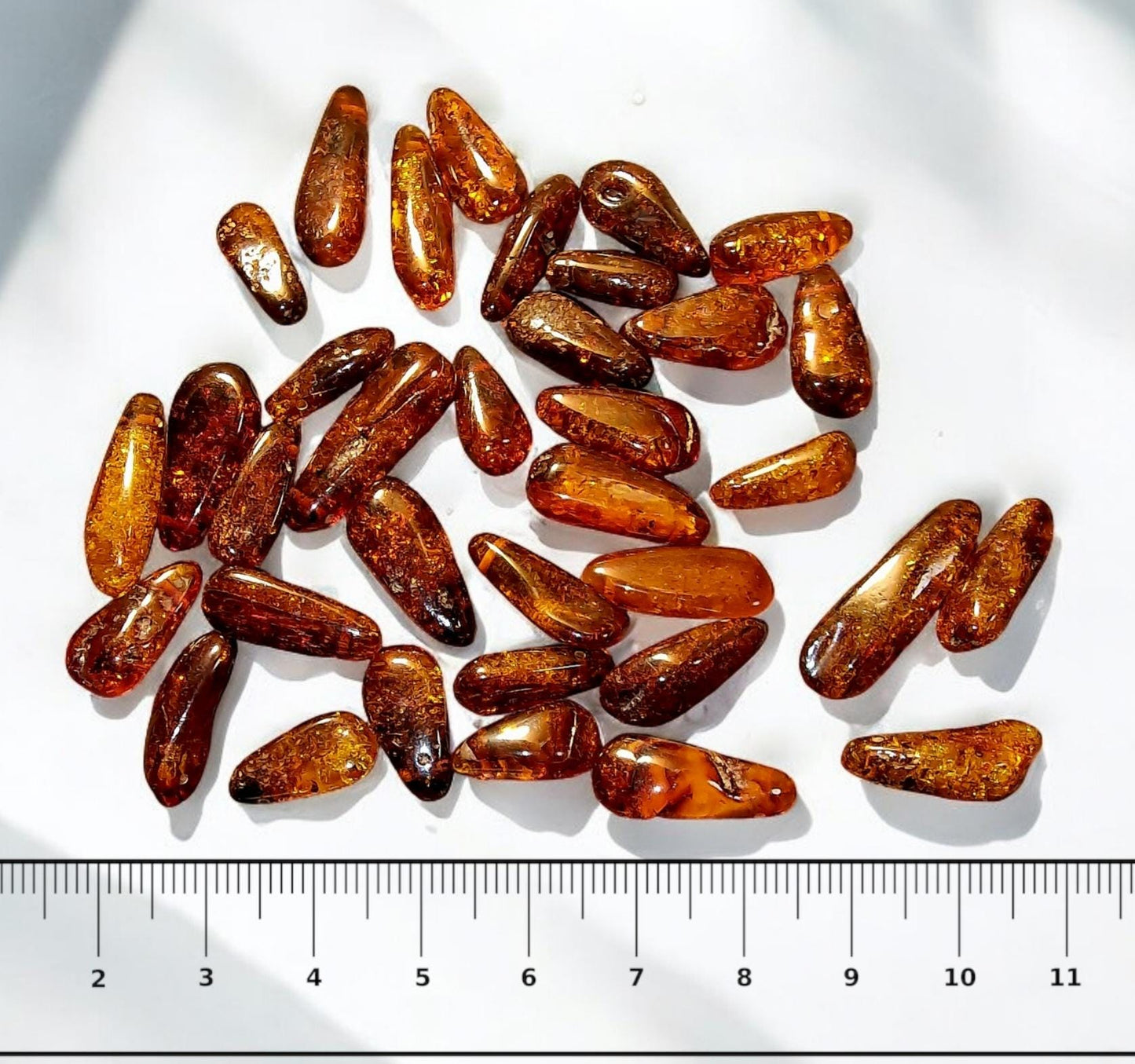 Polished Cognac Baltic Amber Beads: Olive Shape, Top Drilled (33pcs)